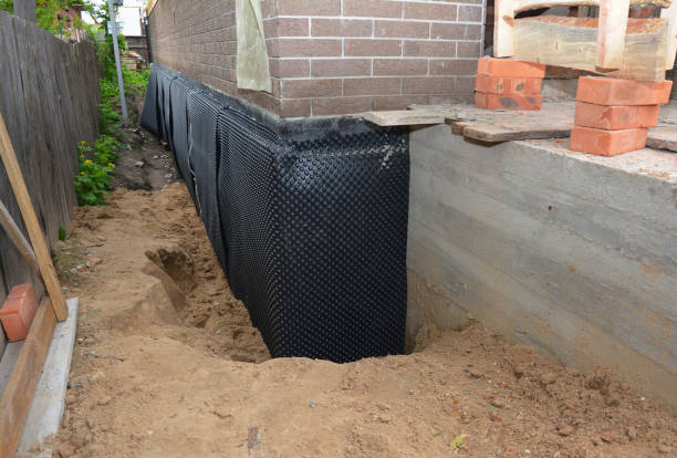 Happy homeowners after waterproofing job in Glassboro